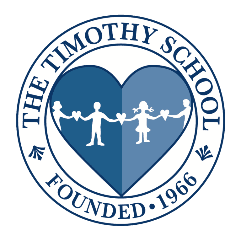 Timothy School Logo. Blue heart surrounded by a circle with The Timothy School written in black and blue lettering.